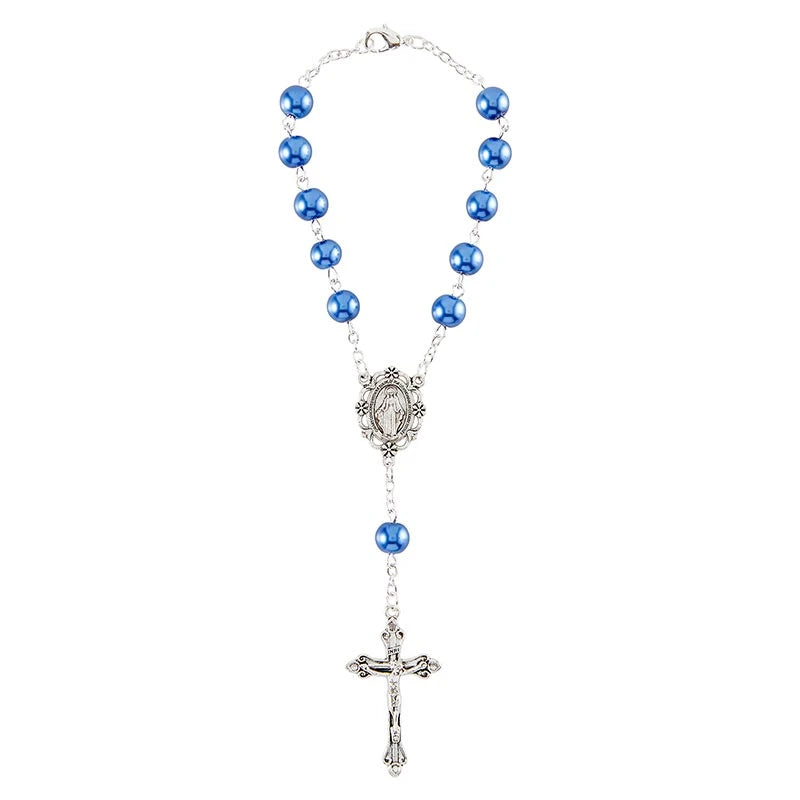 Rosary with blue beads and a silver cross on a white background