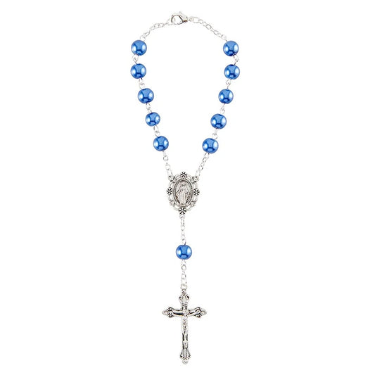 Rosary with blue beads and a silver cross on a white background