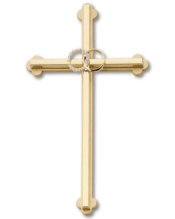 Gold cross pendant with a circular design on a white background