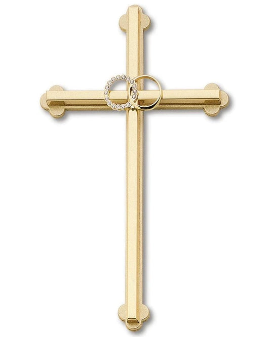 Gold cross pendant with a circular design on a white background