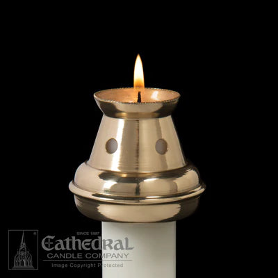 Brass candle holder with a lit candle on a black background, featuring the Cathedral Candle Company logo.