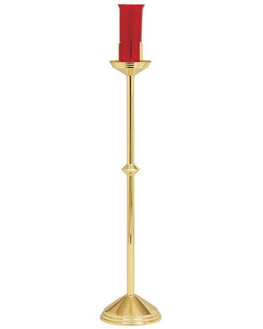 Gold candle holder with a red candle on a white background