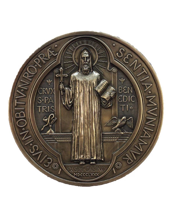 Bronze medal with religious figure and inscriptions on a white background
