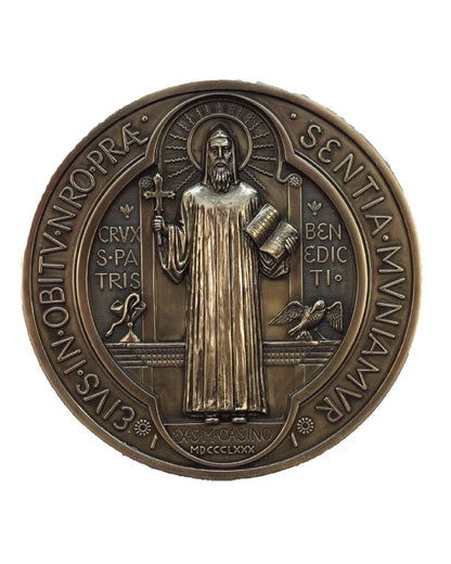 Bronze medal with religious figure and inscriptions on a white background