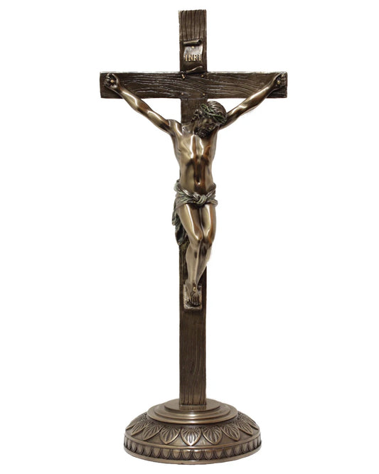 Bronze statue of a crucifixion on a white background