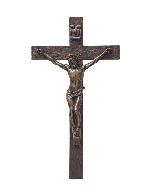 Bronze crucifix on a white background