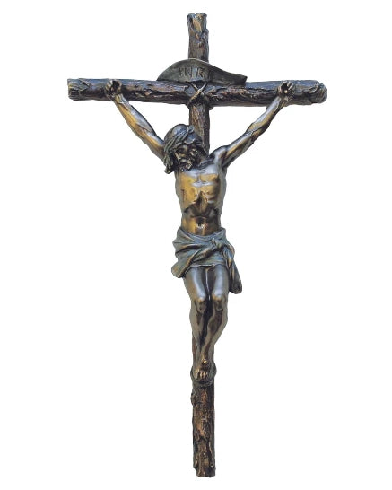 Bronze crucifix with Jesus Christ on a white background