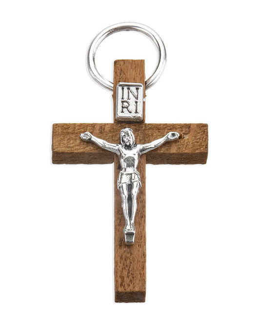 Wooden cross keychain with silver Jesus figure and 'INRI' inscription on a white background