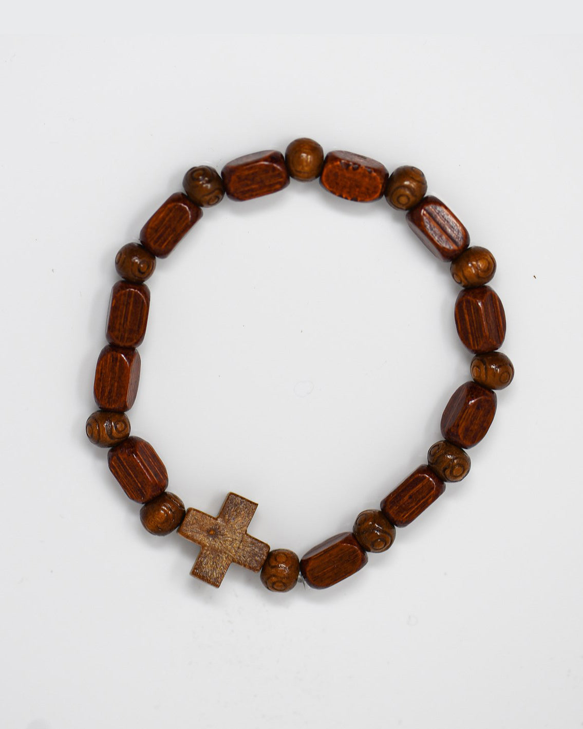 Beaded bracelet with a cross charm on a white background