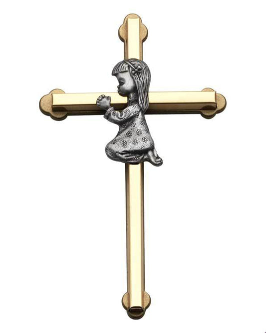 Gold cross with a silver figure of a child on a white background
