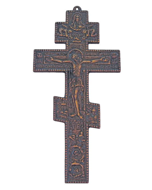 Decorative cross with religious iconography on a white background