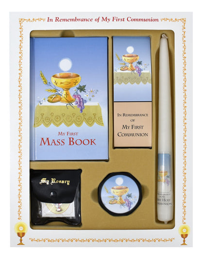 First Communion gift set with Mass book, candle, rosary, and other items in a decorative box.