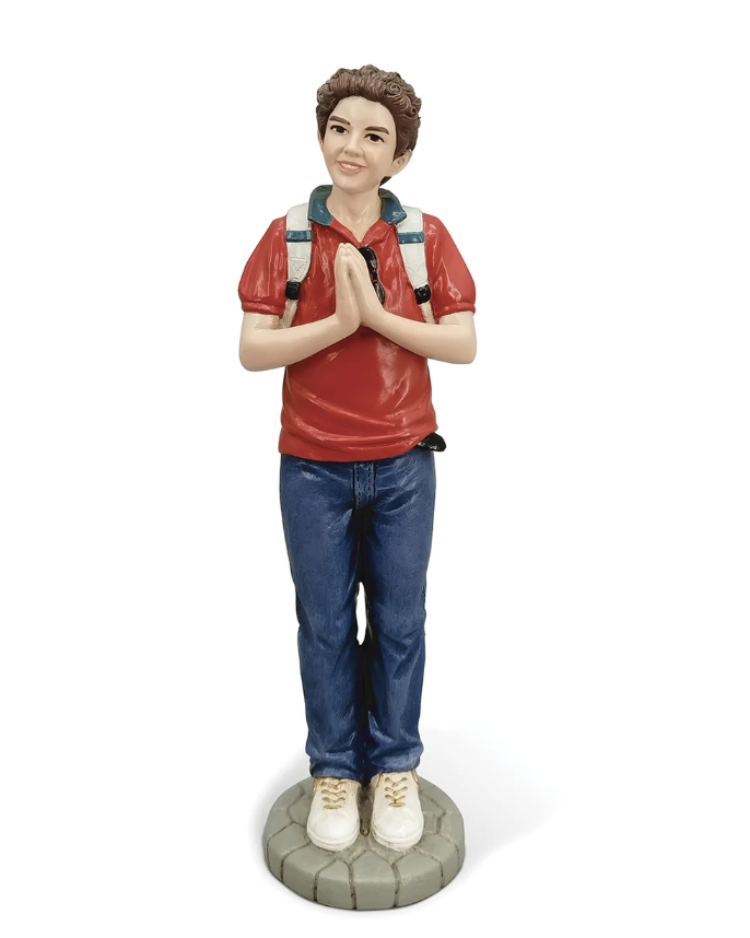 Statue of a person wearing a red shirt, blue jeans, and a backpack on a white background