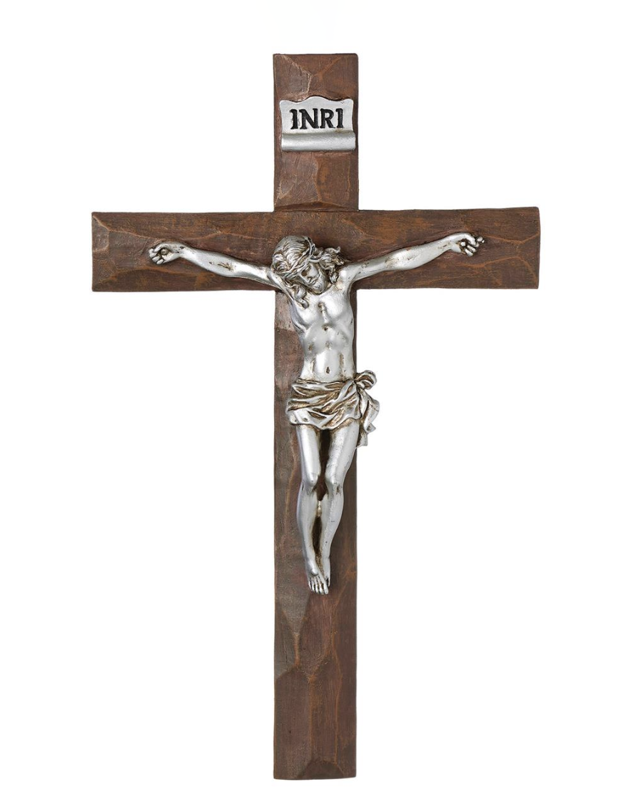 Wooden cross with silver Jesus figure on a white background