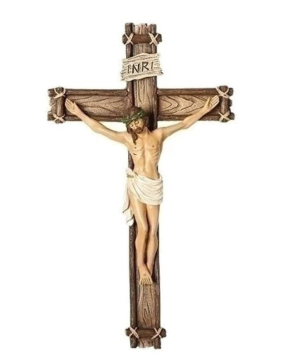 Wooden crucifix with Jesus Christ figure on a white background