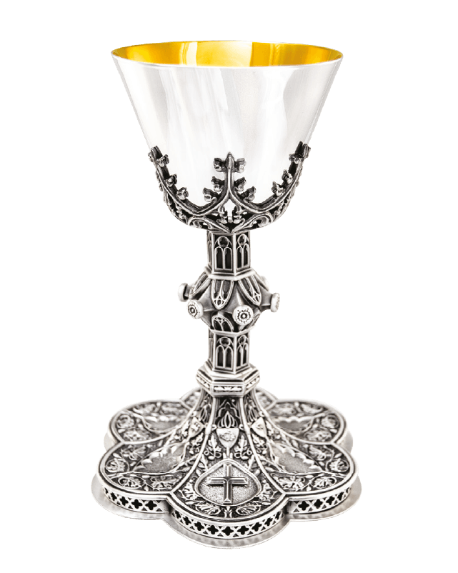 An ornate silver chalice with a polished silver-tone metal body, featuring intricate filigree detailing, a central cross, and a bright gold interior, shown on a plain white background.