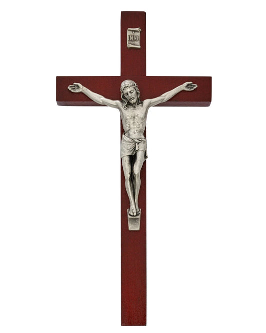 Wooden cross with silver Jesus figure on a white background