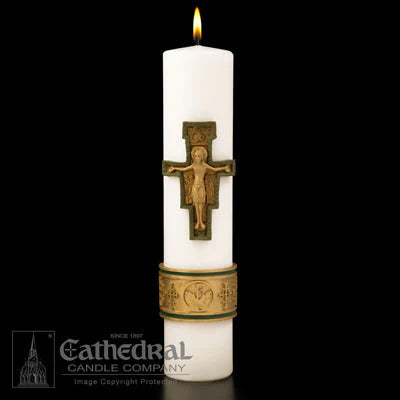 White candle with a brass cross and decorative band on a black background, featuring the Cathedral Candle Company logo.