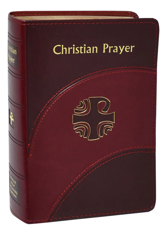Maroon prayer book with gold text and cross emblem on a white background
