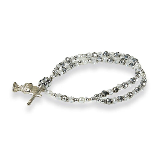 A crystal and silver tone beaded bracelet with a chalice and crucifix dangle, indicative of a First Communion gift.