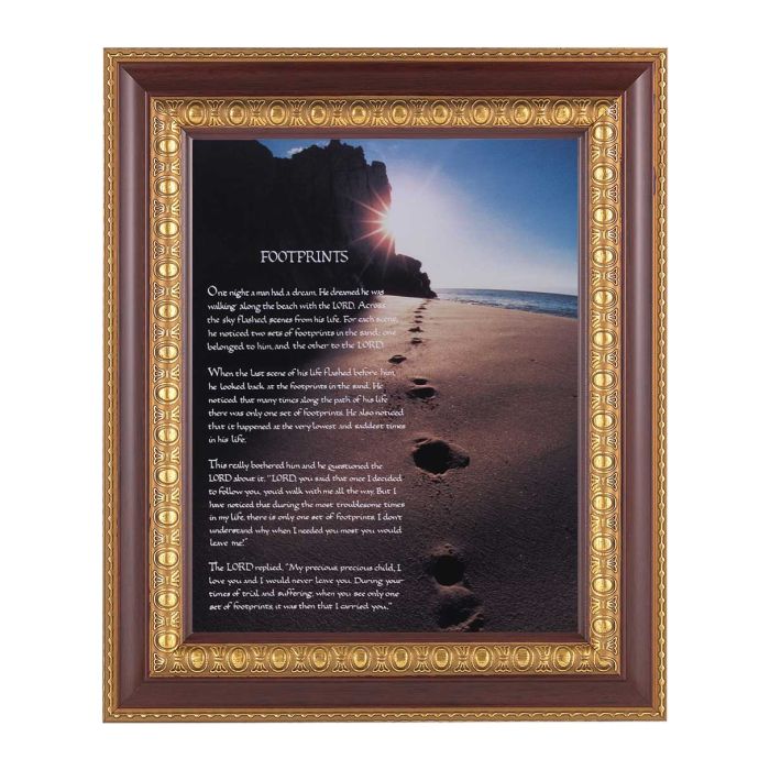 Framed artwork of footprints in the sand with a sunset over water, featuring the 'Footprints' poem.