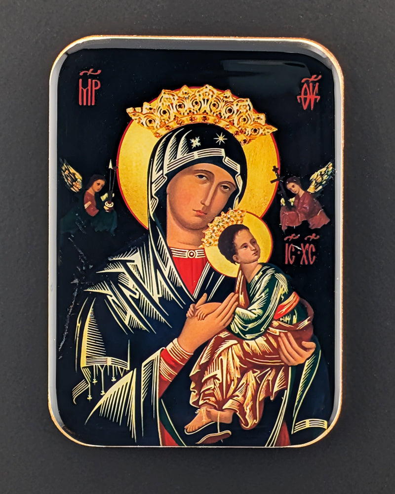 Decorative byzantine-style icon with a central figure holding a child, surrounded by angels on a dark background.