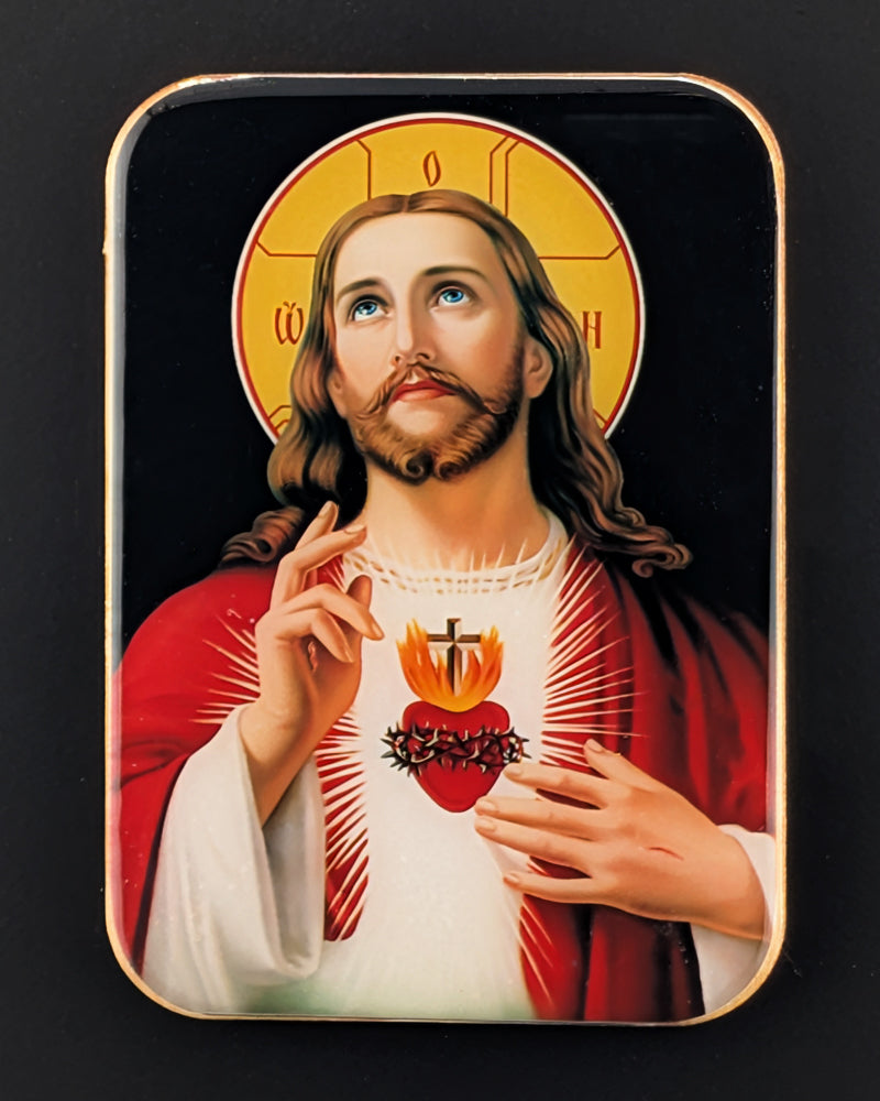 Icon of a religious figure with a red robe and white shirt on a black background