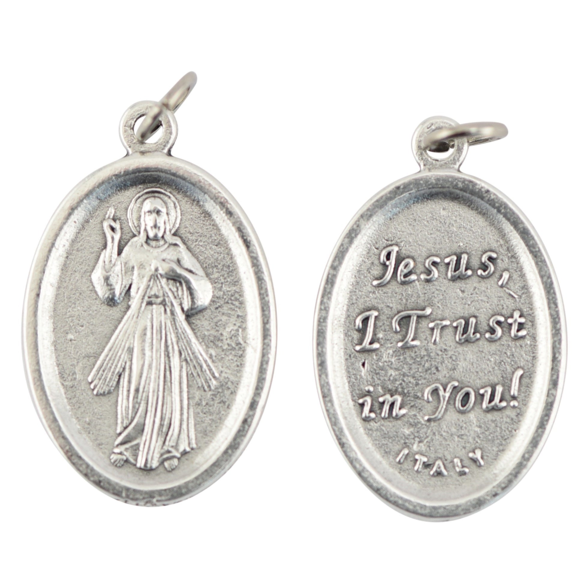 Silver religious pendant with 'Jesus, I Trust in You!' inscription on a white background