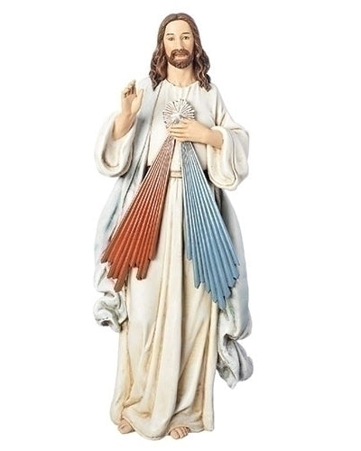 Statue of a religious figure with colorful heart design on a white background
