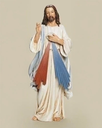 Statue of a religious figure with multicolored robes on a beige background