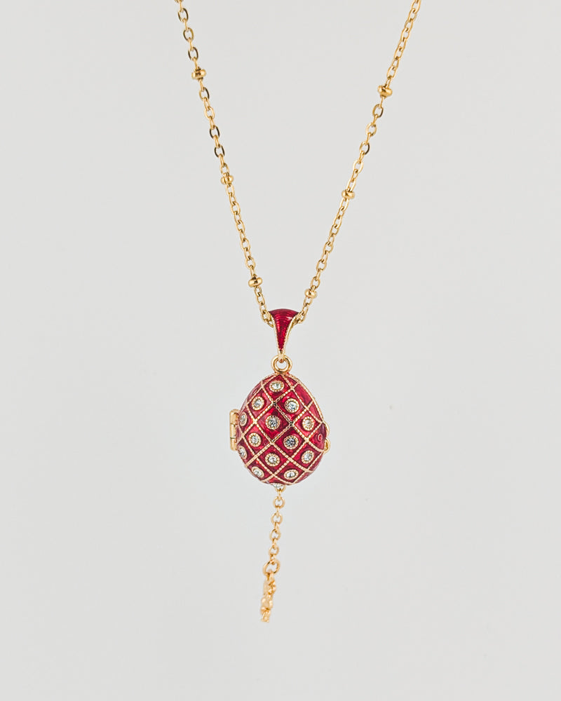 Necklace with a red pendant on a light gray background
