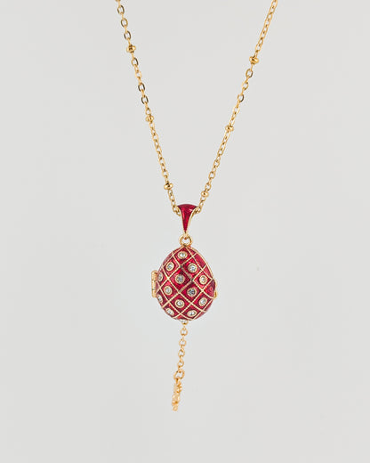 Necklace with a red pendant on a light gray background