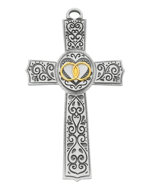 Decorative cross pendant with heart design on a white background