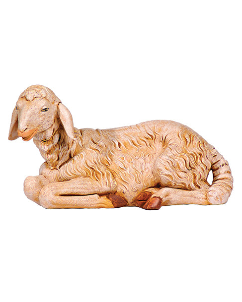Statue of a lying sheep on a white background