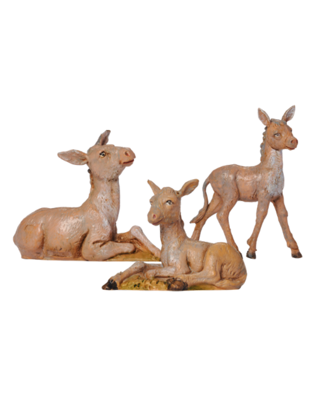 Three donkey figurines on a white background