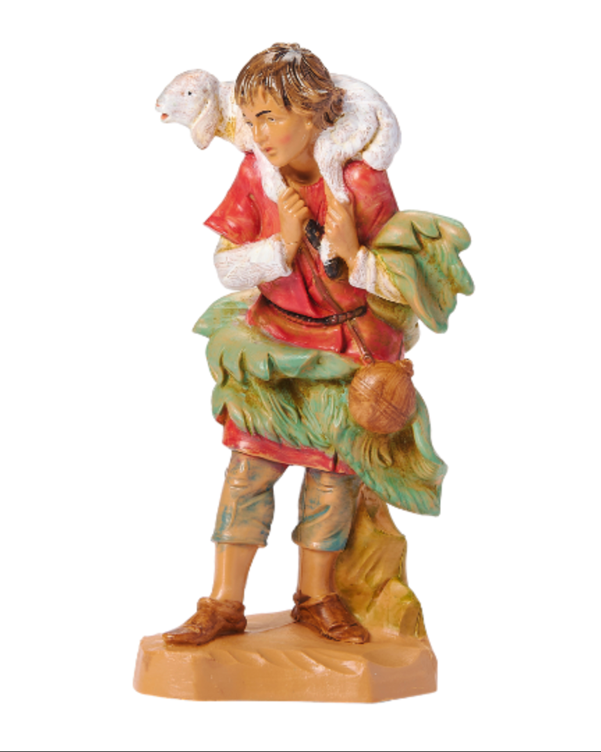 Figurine of a shepherd with a lamb on a white background