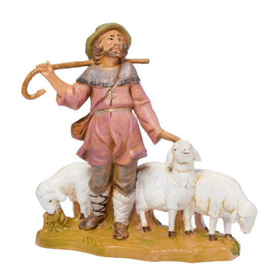 Statue of a shepherd with sheep on a white background