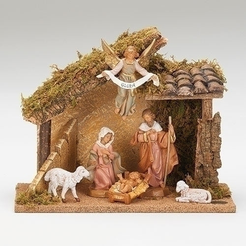 A Fontanini 7 piece nativity set featuring figures of the Holy Family, an angel, two sheep, and a stable, all in green, brown, and beige colors.