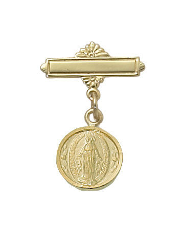 Gold baby badge with a pendant on a white background
