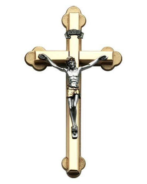 Gold and silver crucifix on a white background