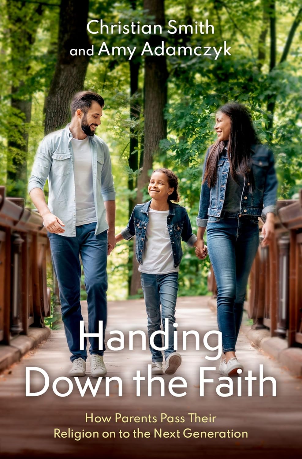 Cover of 'Handing Down the Faith' book with a family walking on a wooden bridge in a forest.