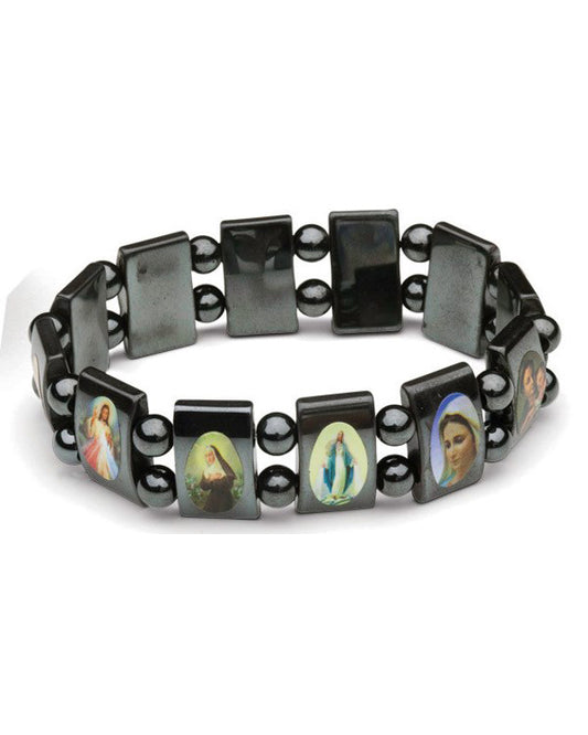 Bracelet with black beads and religious icon charms on a white background
