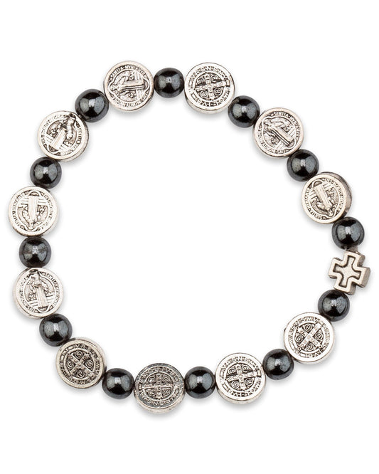 Bracelet with black beads and silver religious charm on a white background