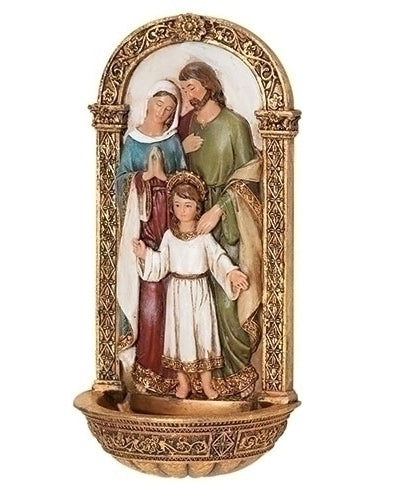 Decorative figurine of a family with ornate gold frame on a white background