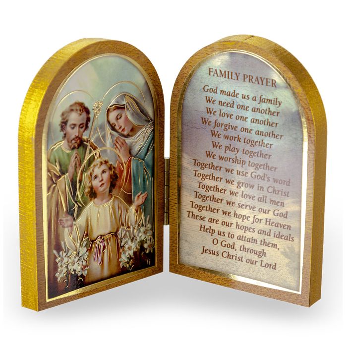 A gold embossed natural wooden diptych with a depiction of the Holy Family and a prayer for family on the inner side of the panels.