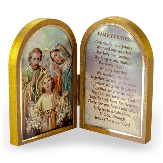 A gold embossed natural wooden diptych with a depiction of the Holy Family and a prayer for family on the inner side of the panels.