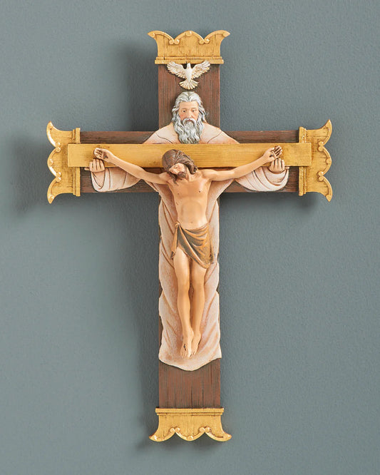 Decorative crucifix with religious figures on a gray background