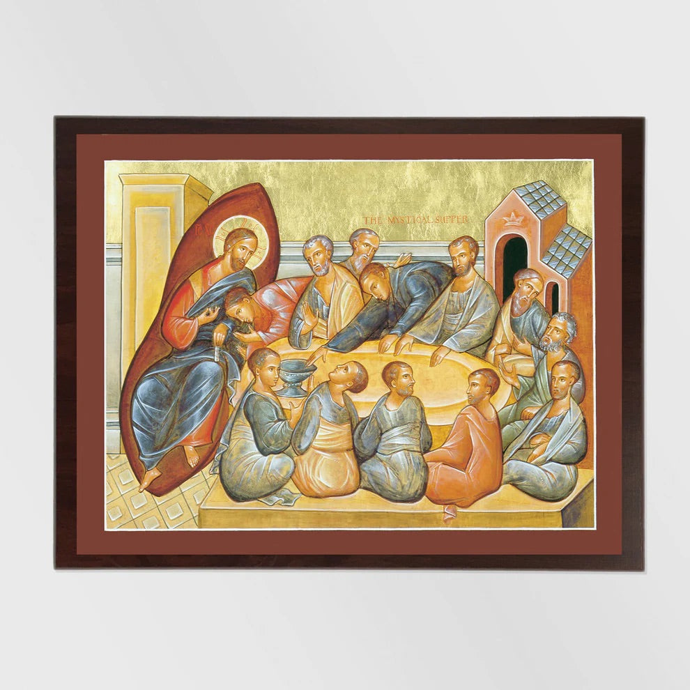 Framed artwork depicting a religious scene with figures in a room.