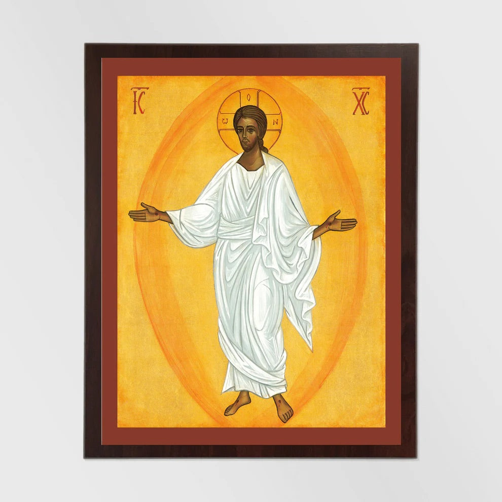 Framed artwork of a person in a white robe with a yellow background