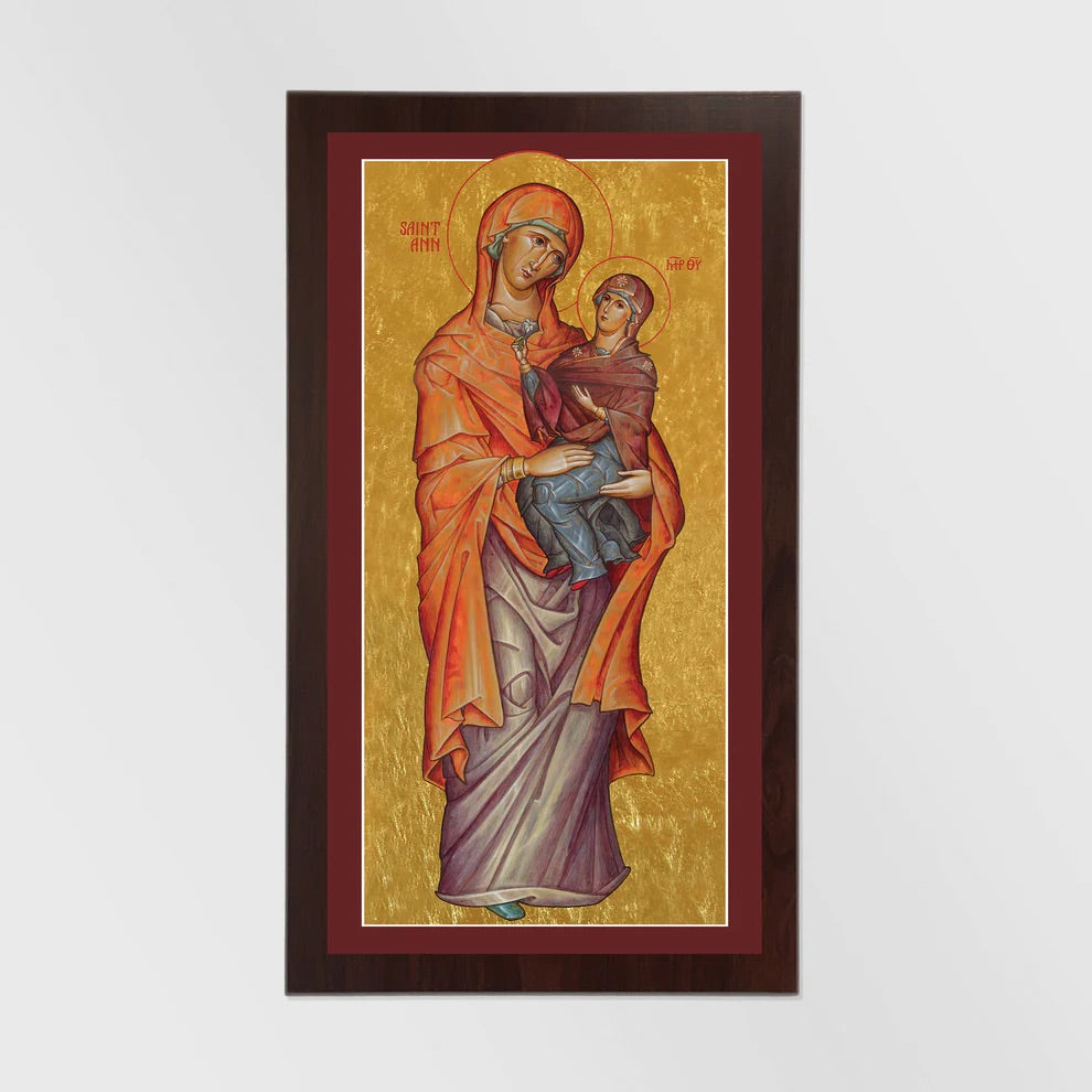 Icon of a woman holding a child on a gold background with a brown frame.